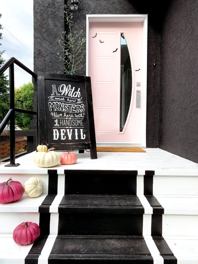 pink door black exterior tricorn black halloween front door decor bats